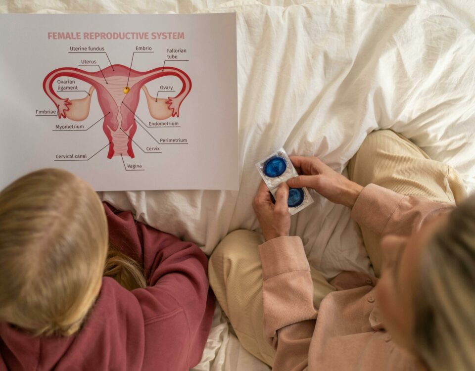 A mother and daughter learning about female reproductive health and contraception.